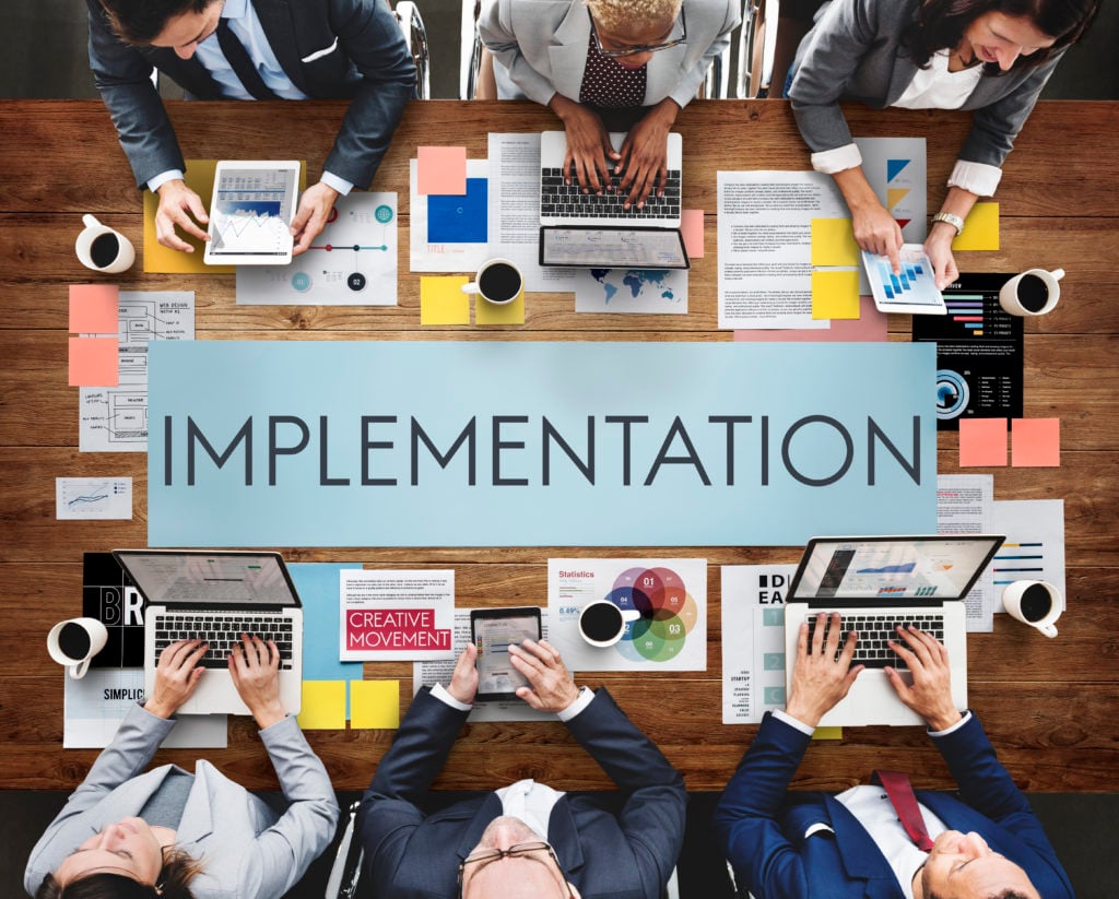 A team of businessmen implementing business strategies for growth